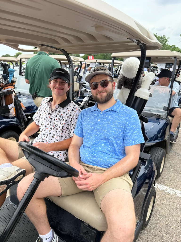 Two alumni enjoying the Reunion Weekend golf tournament