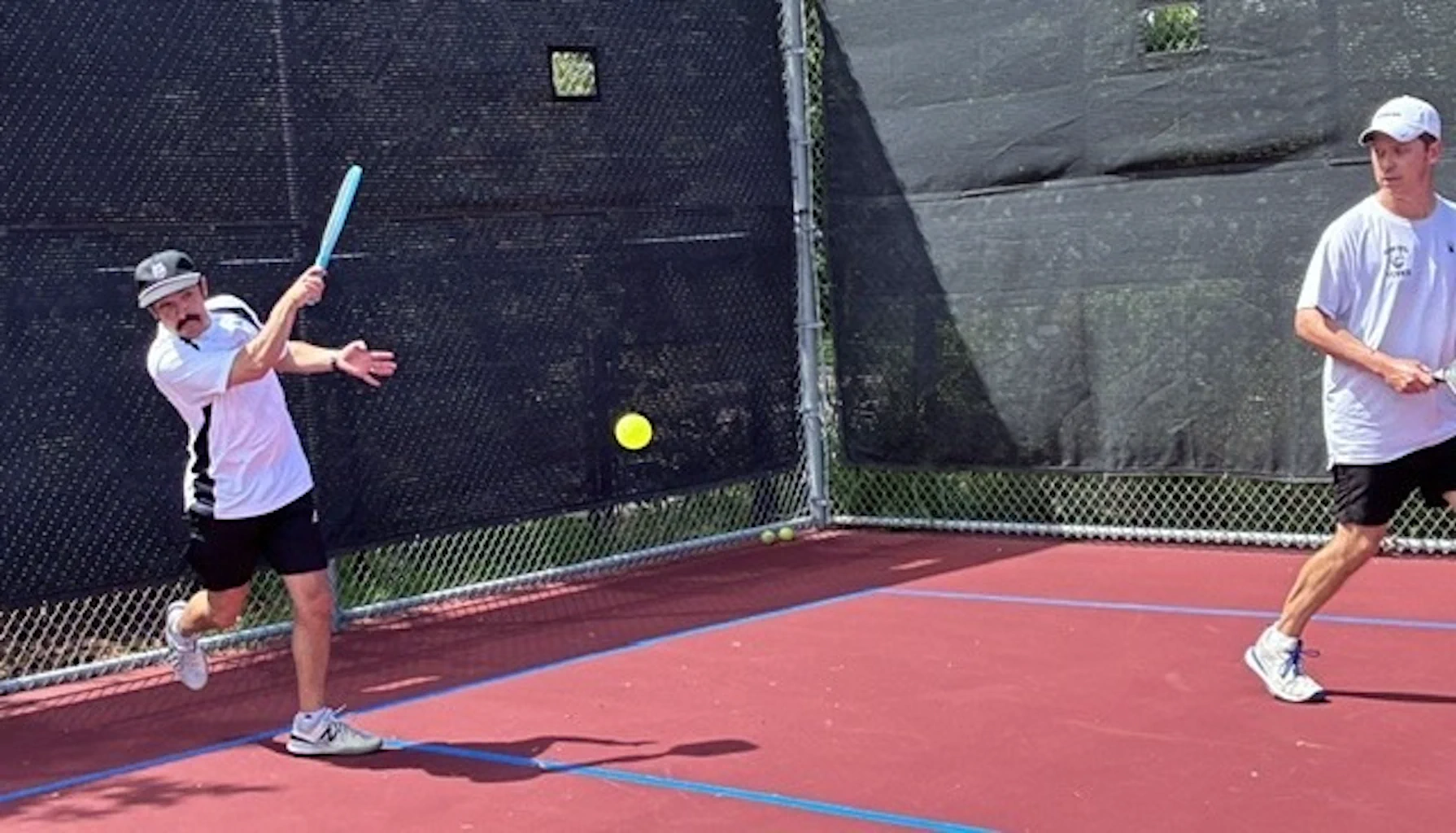Pickleball player hitting a forehand shot