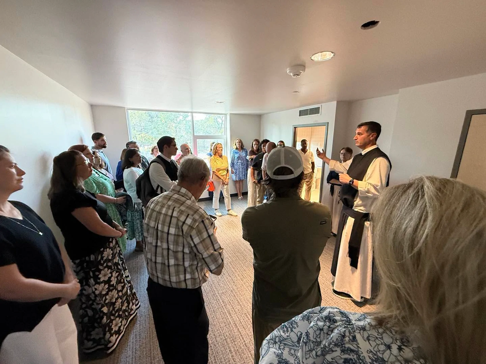 Fr. Anthony speaking to guests