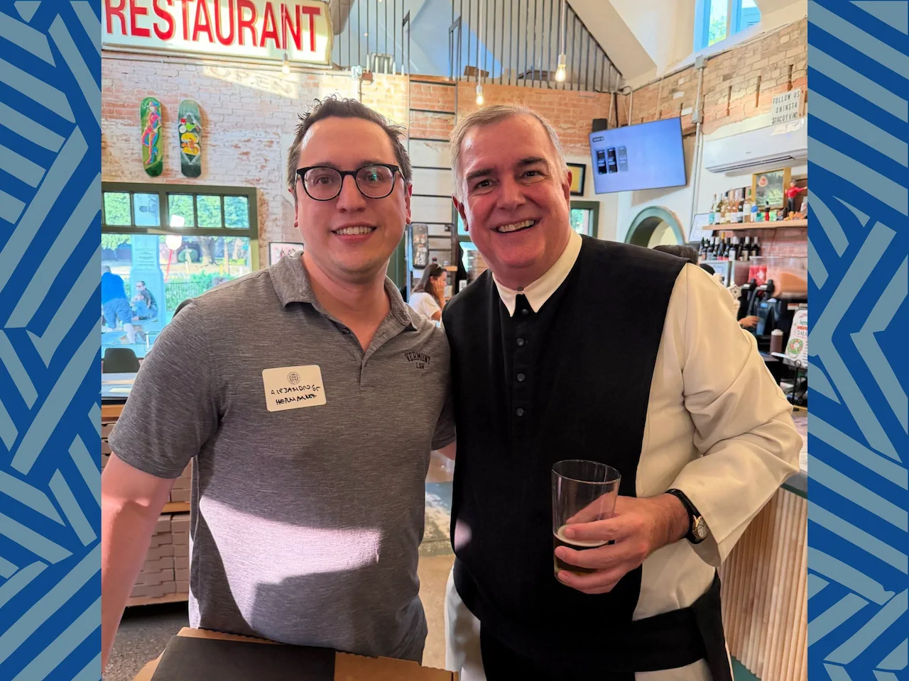 Fr. Paul and attendee smiling together at the Cistercian Class Agent and Alumni Board Gathering at Cenzo’s Pizza & Deli.