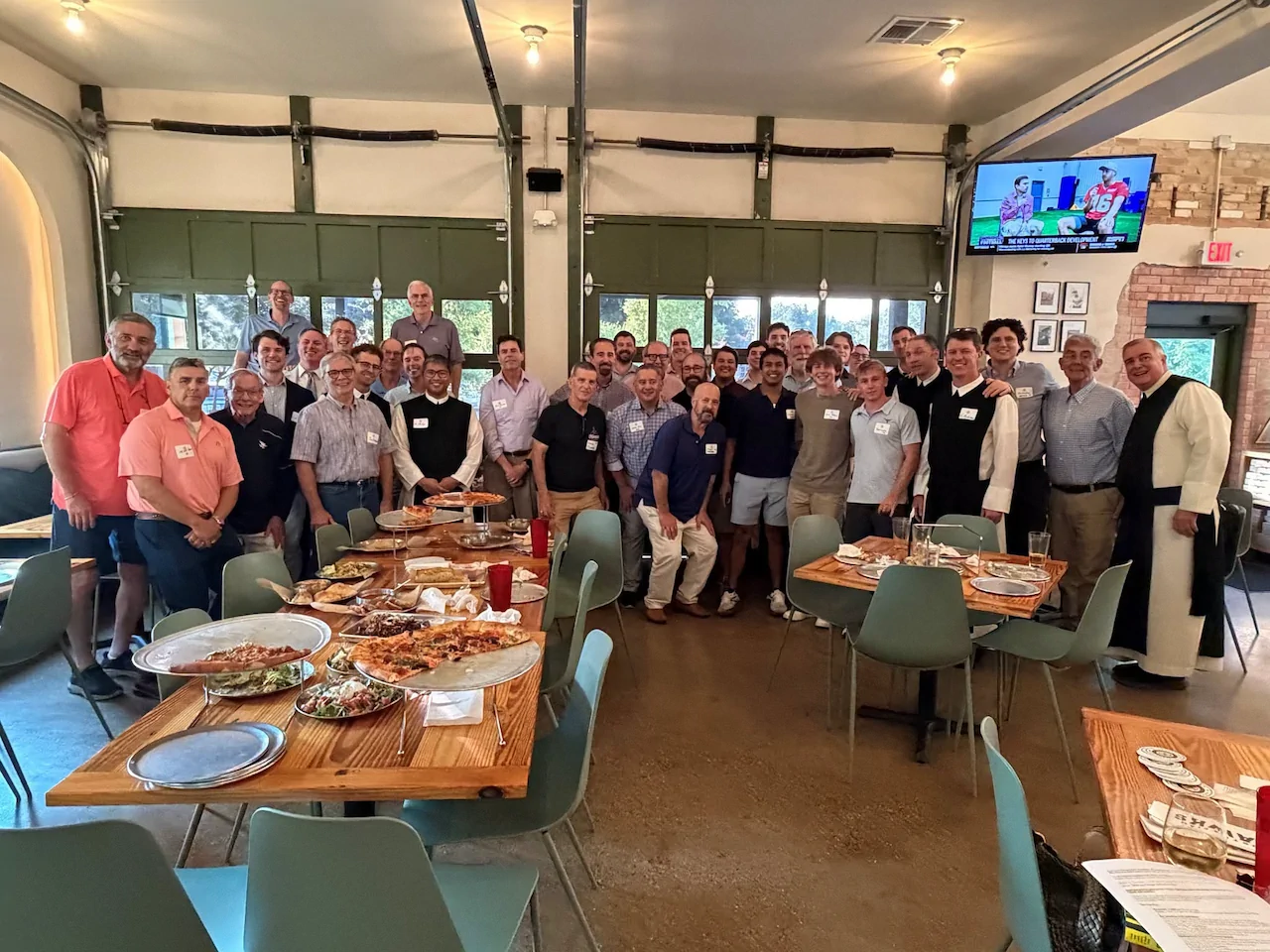 Cistercian alumni, monks, and guests gathered for a group photo at the annual Class Agent and Alumni Board Gathering.