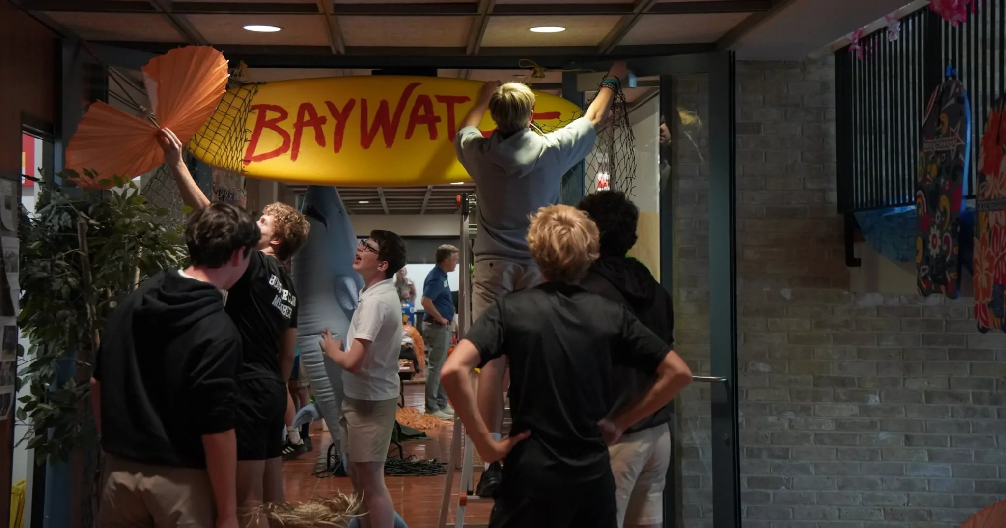 2026 Freshman Mixer hanging the sign
